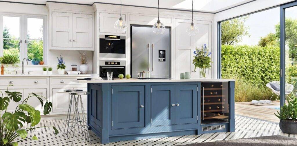 A well-designed kitchen highlighting a blue island and white cabinets offering a fresh and elegant look