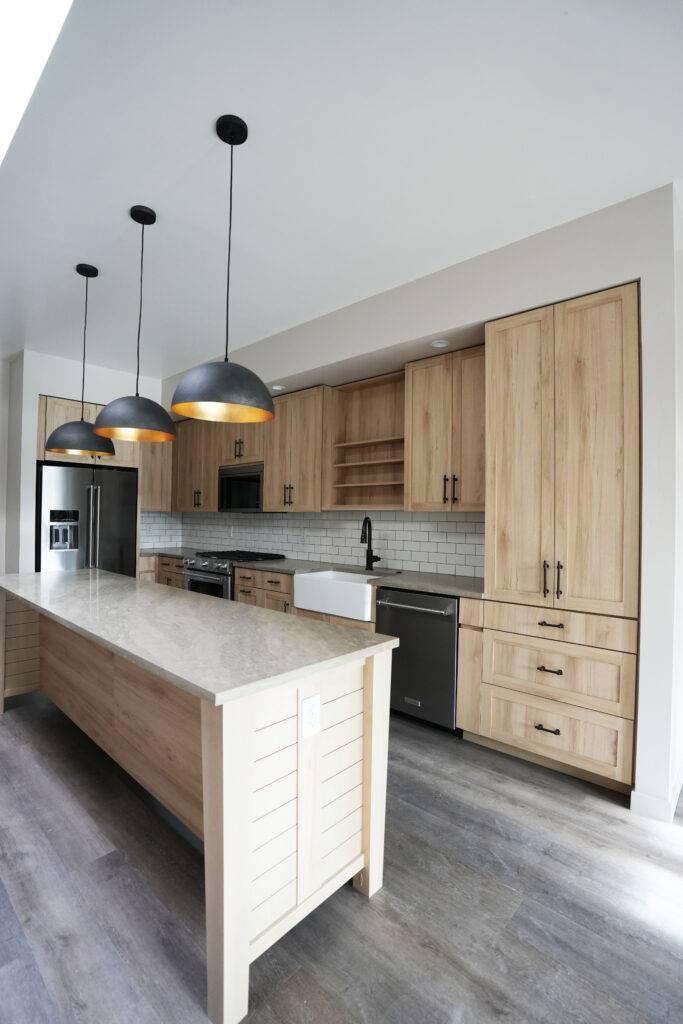 Kitchen island featuring a wooden countertop, designed for functionality and style by scs Multifamily