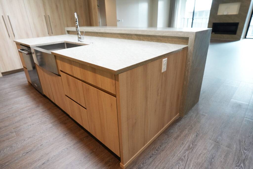 A kitchen featuring a sink and countertop, designed for functionality and style by scs Multifamily.