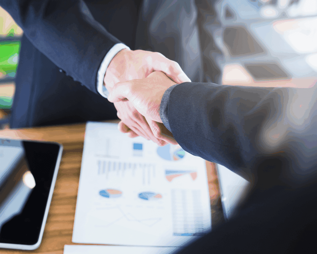Business handshake over documents